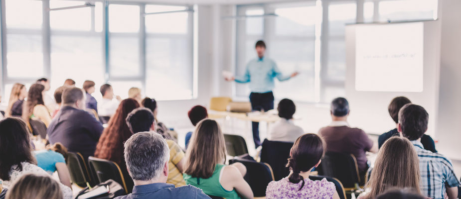 Speaker Giving a Talk at Business Meeting.